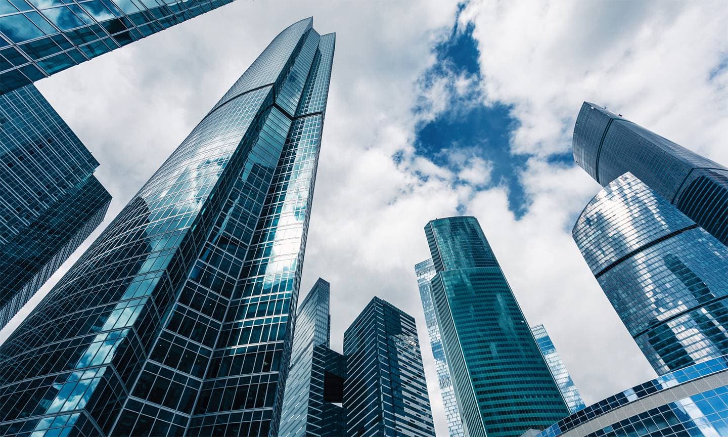 Glass office towers seen from below