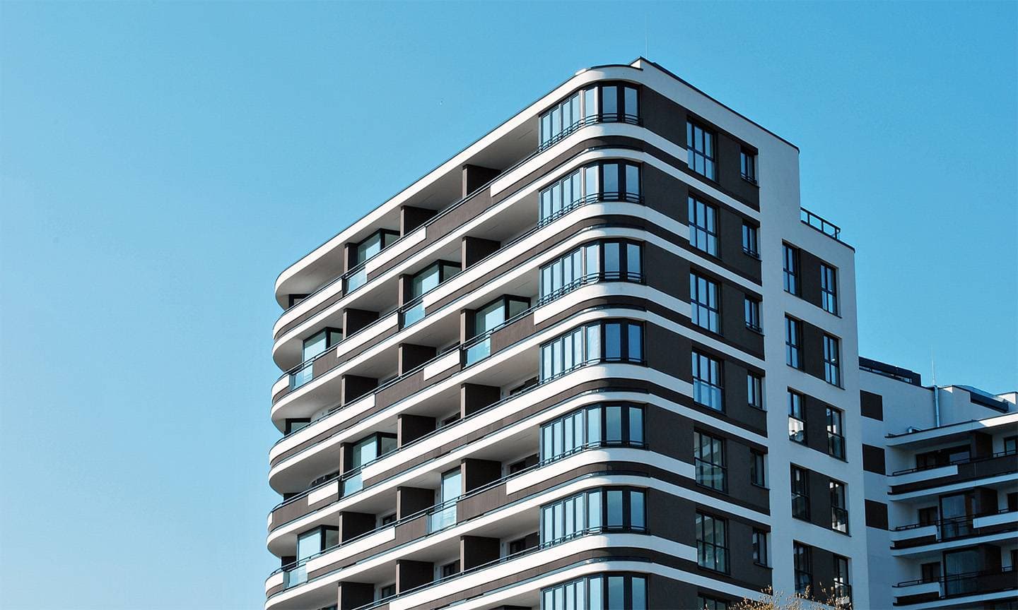 Modern residential building against a blue sky